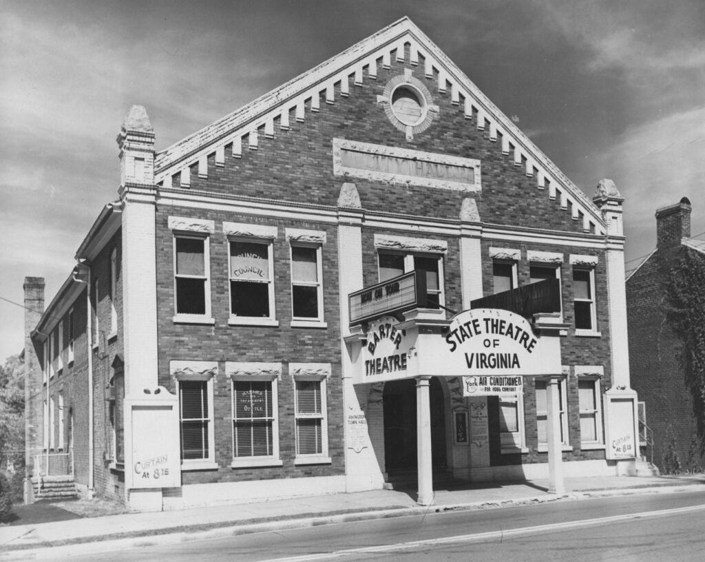 A brick building with signage reading, "Barter Theatre; State Theatre of Virginia"