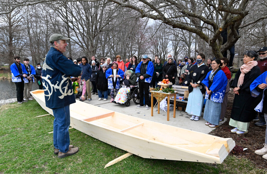 Douglas Brooks leading a Japanese boat launching ceremony.