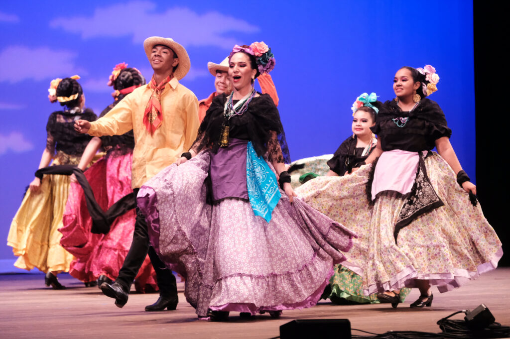 Ballet Folklórico De Detroit and Flor de Toloache perform on stage at the Temple Theatre.