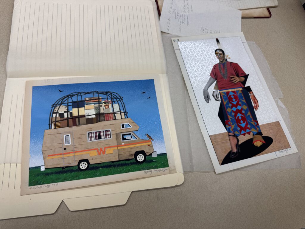 Two pieces of art in manila folders.