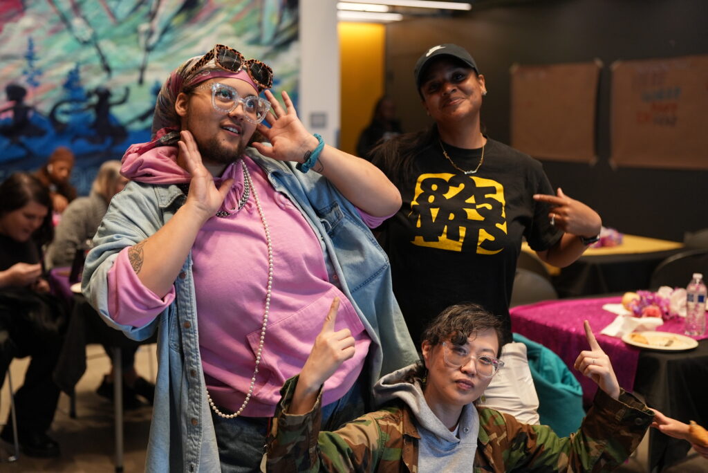 Three people posing for a photo.