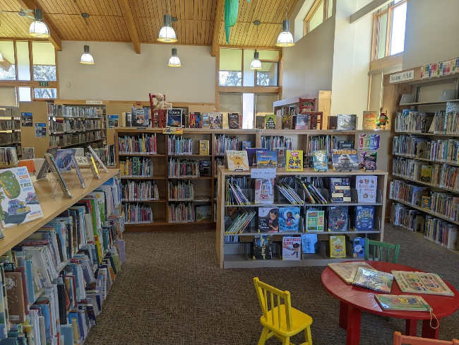 Shelves of books in a peaceful and welcoming room.