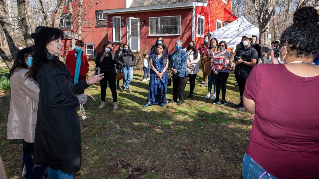 Joy Harjo is welcomed into Shinnecock Indian Nation by the indigenous community. In this outdoors meeting Joy and the community share stories about the earth and the importance of living with nature.