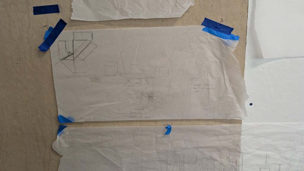 Paper with pencil drawings taped to a wall.