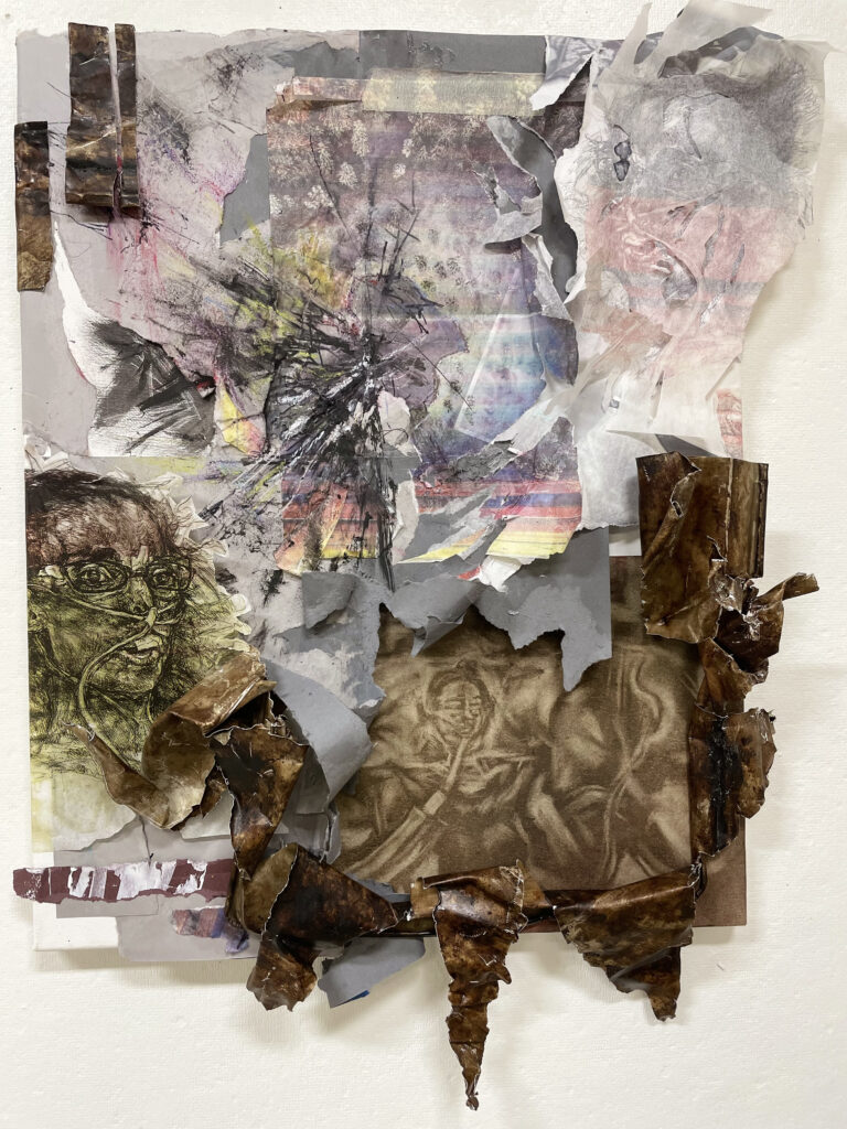 A collage of various pieces of paper on a wall. Faces with feeding tubes are visible in several places of the collage.