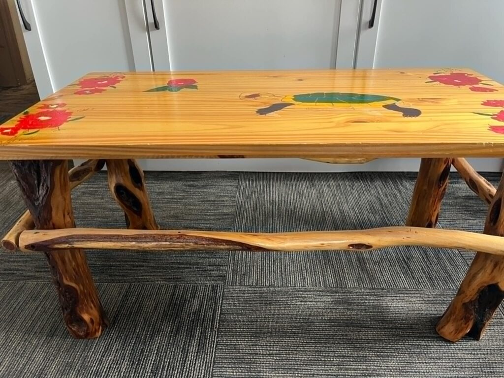 A painted wooden bench inside